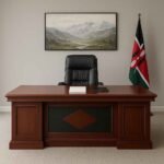 Spacious 2M executive office desk in rich mahogany veneer with black accent panels and polished surface, ideal for CEO office setups in Nairobi