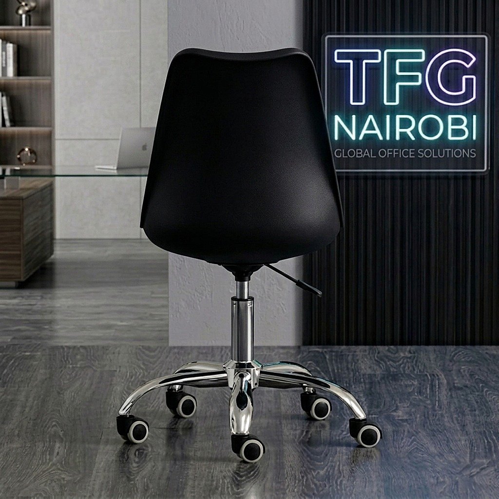 EO1300B Eames Office Chair - Back View Ngong Road Collection Rear view of the black EO1300B Eames-style office chair showing the smooth ergonomic back shell and high-polished chrome base in a Ngong Road home office.