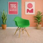 EO1571G Eames armchair with wooden legs and molded plastic shell in a modern Karen Nairobi apartment setting.