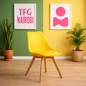 Vibrant yellow EO1300YM Eames chair with natural wooden legs in a stylish Karen home, Nairobi.