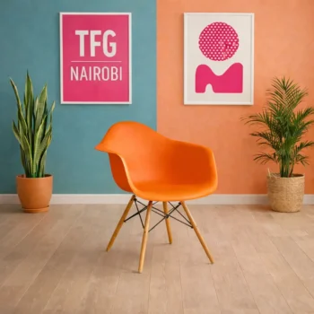 EO1571O Eames armchair with wooden legs and molded plastic seat shell in a luxury Karen Nairobi apartment.
