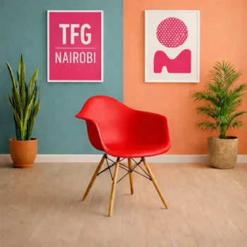EO1571R Eames armchair with wooden legs and molded plastic seat shell in a luxury Loresho Nairobi studio apartment.