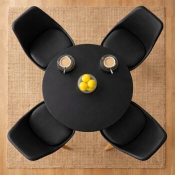 Top-down birds-eye view of a black HM7813 round dining table with four matching black chairs on a jute rug in Karen, Nairobi.