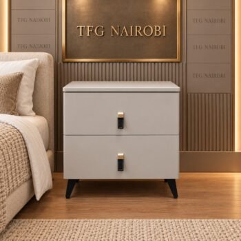 Modern 2-Drawer Bedside Nightstand in smooth light grey finish featuring black leather loop handles with gold hardware clips and tapered black legs staged in Lavington, Nairobi