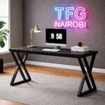 Executive STUDIO C BL400 computer desk with architectural X-frame legs in a modern Mimosa, Runda home office, Nairobi.