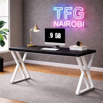 Modern STUDIO C WHBL400 computer desk with a sleek white wooden top and white X-frame metal legs in a luxury Ineza, Runda home office, Nairobi.