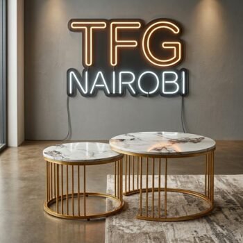 Luxurious J304 Marble Nesting Tables with white marble tops and gold frames in a modern Kileleshwa studio apartment, Nairobi.