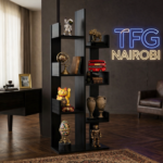 A premium matte black TFG TR600-2 tree bookshelf with modern branch-style shelves displaying collectibles in a luxury Riverside Drive apartment, Nairobi.