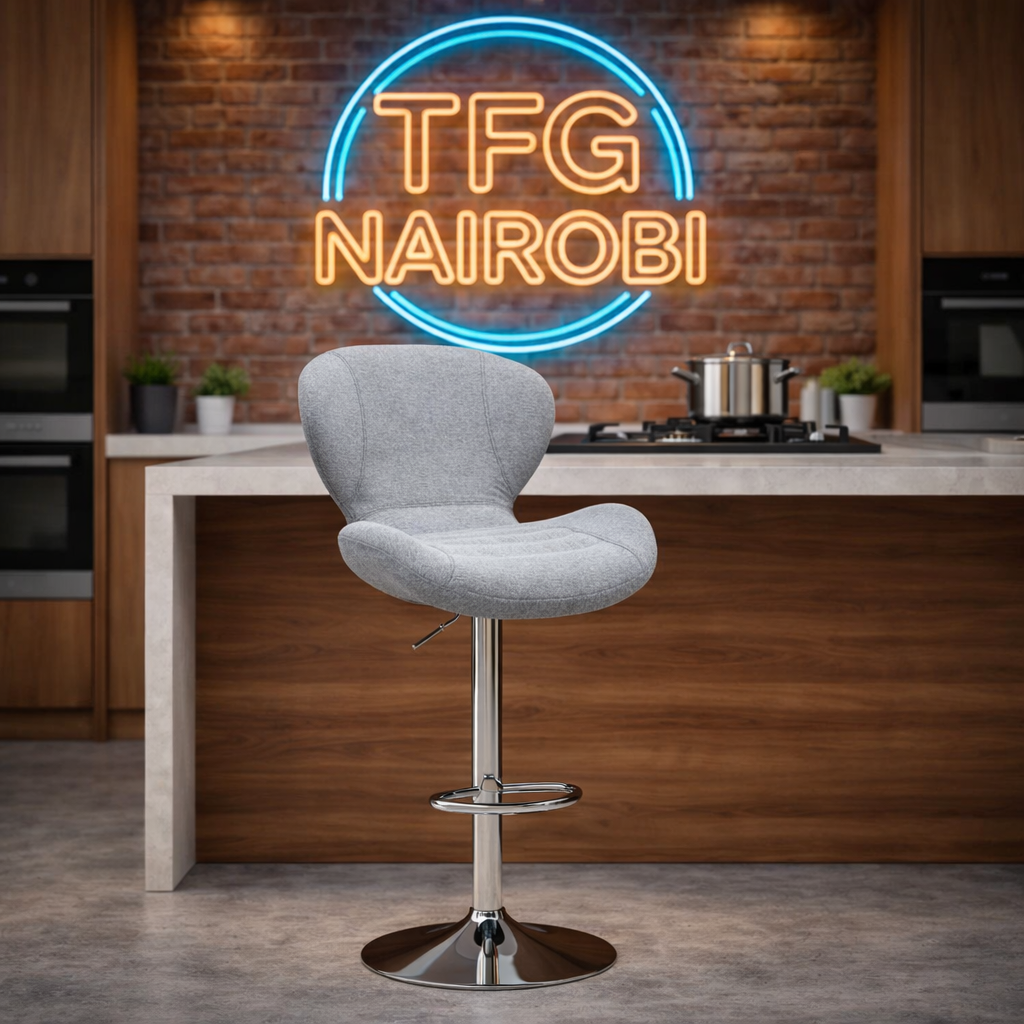 BS028 Grey Fabric Bar Stool – Muthaiga Executive Series Premium BS028 bar stool with a contoured wing-back design and polished chrome base in a luxury kitchen at Mua Park Road, Muthaiga, Nairobi.