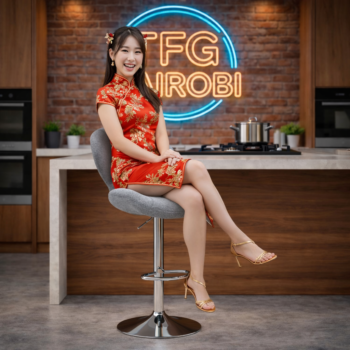 A smiling Chinese lady in a traditional red dress sitting on a BS028 grey fabric adjustable bar stool with a chrome swivel base in a luxury Muthaiga kitchen, Nairobi.