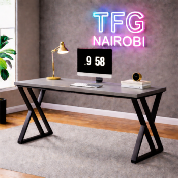 Modern STUDIO C BLGR400 computer desk with a slate grey top and architectural black X-frame metal legs in a luxury Ineza, Runda home office, Nairobi.