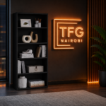 Modern TFG-B800 black bookshelf and minimalist display unit with a warm neon TFG Nairobi sign in a luxury home office at Mimosa, Runda.