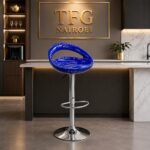PMBS800-1 blue bar stool with a chrome pedestal base staged next to a modern kitchen island under the TFG Nairobi logo.