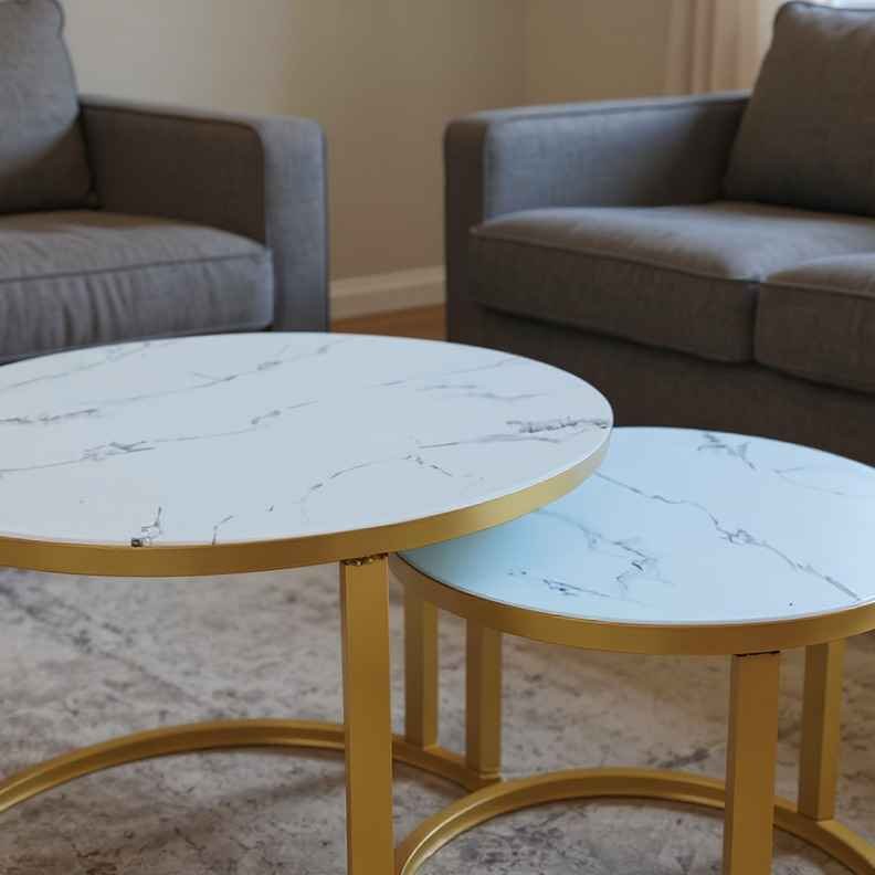 T09 Glass Top Close-Up Close-up of T09 glass top nesting tables with faux marble veining and gold frame