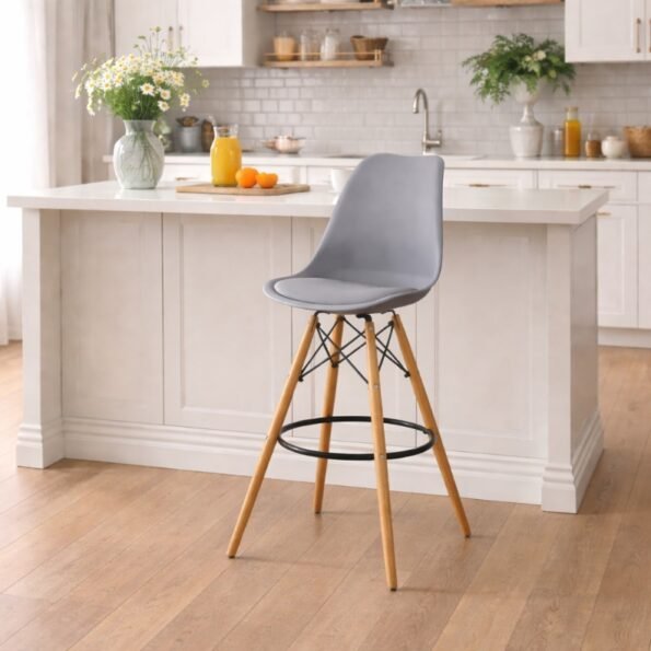 Gray EO1801 Eames bar chair with padded PU leather seat and chrome braces in a modern Lavington kitchen.
