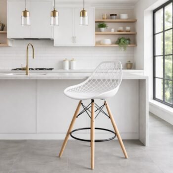 EO194W white Eames bar chair with beech wood legs at a modern kitchen counter in a Hurlingham apartment.