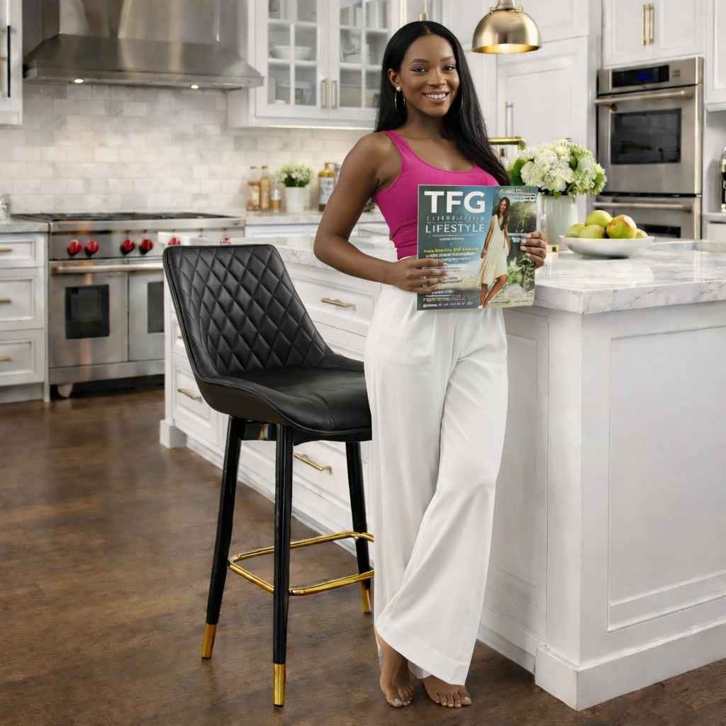 LUX1874 Kitchen Island Stool – TFG Lifestyle Branding Brand showcase of the LUX1874 black quilted leather kitchen island stool with gold accents and the TFG Lifestyle Magazine in a Westlands home.
