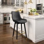 Luxurious LUX1874 black quilted PU leather bar stool with gold accents and swivel design in a modern Karen kitchen.