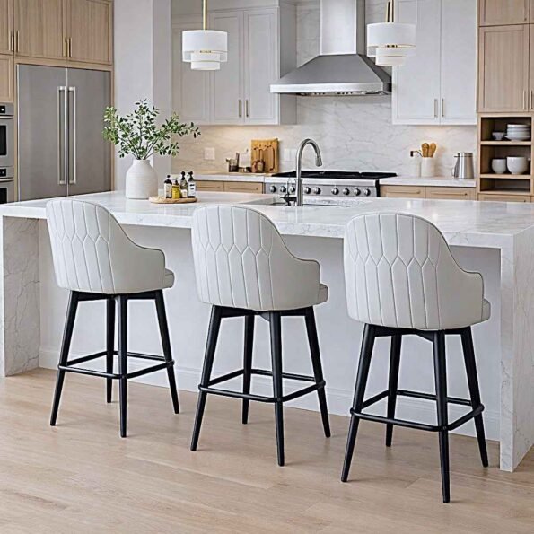 A trio of HZ971 luxury cream tufted bar stools with arms and matte black legs at a marble kitchen island in Upper Hill, Nairobi.