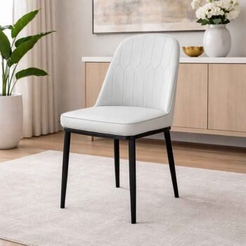 JNRD11-1 white PU leather dining chair with curved back and diamond quilting in a modern Kilimani, Nairobi apartment.