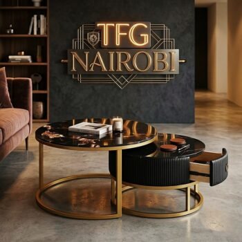Luxury J405 nesting coffee table set in a Kileleshwa living room featuring an open grey leather storage drawer and gold architectural frame.