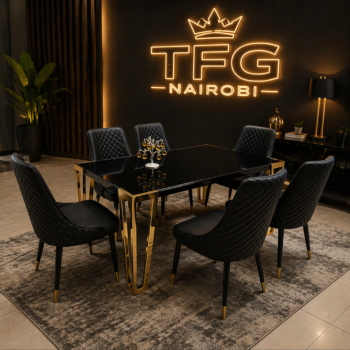 LUX1877 dining table and chairs featuring a black tempered glass table with gold legs and quilted black leather chairs in a Westlands penthouse, Nairobi.
