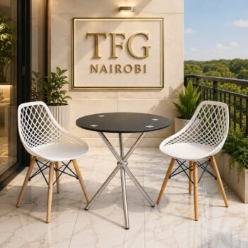 ECBT3-1 Balcony Set by Eames & Vitra Nairobi – 2-seater outdoor bistro set with round black glass-top table, chrome legs and white lattice-back chairs with wooden legs, styled on a luxury marble balcony in Karen, Nairobi, Kenya