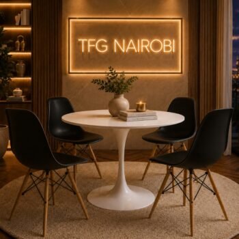 EOVC1278-2 Eames Dining Table and Chairs Eames 4-seater dining table and chairs set by TFG Nairobi installed in a Hurlingham home along Arwings Kodhek Road, featuring a white round tulip table and four matte black molded chairs.