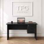 The premium 1.4m Black Executive Desk Nairobi by TFG Nairobi with three lockable drawers set against a clean white wood-paneled wall on Muthithi Road, Westlands.