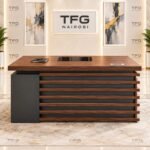 1.4m Executive Office Desk with dark walnut finish, slatted modesty front, central inlay writing pad, and lockable storage pedestal in Upper Hill, Nairobi