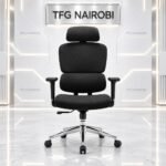 Front view of Ergonomic High Back Office Chair Kenya COLE Q55-1 in all-black fabric with adjustable headrest, 3D armrests, and chrome base against TFG Nairobi studio backdrop in Loresho Nairobi
