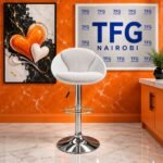 Modern Honeycomb Quilted White Swivel Bar Stool Kenya staged in a luxury showroom with branded TFG Nairobi backdrop in Karen Nairobi